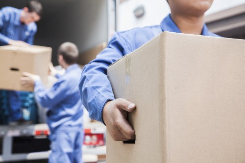 Professional removals team planning a house move in Queens Park