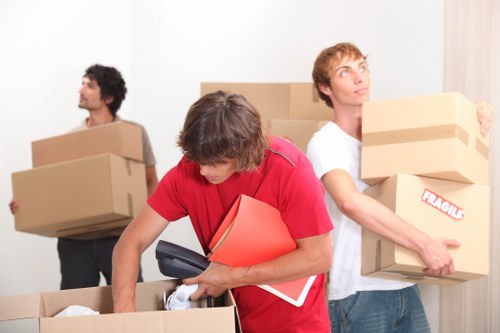 Loading office items into a removal van in Queens Park