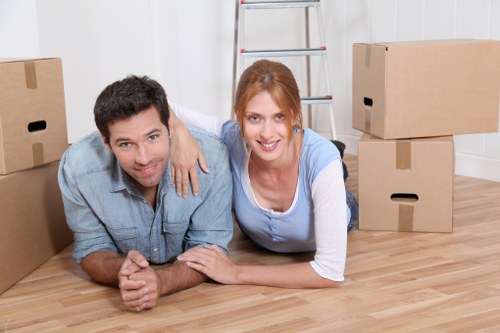 Professional moving service unloading boxes in Queens Park