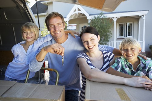 Professional movers handling desks and equipment carefully