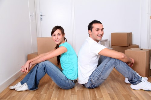 Local movers handling furniture and boxes for a Queens Park move