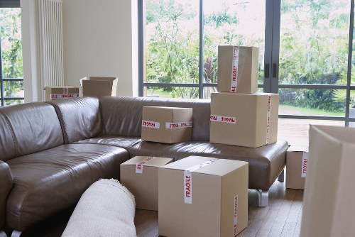 Household furniture being handled during a Queens Park removal