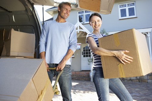 Unpacking boxes and arranging items in a new Queens Park property