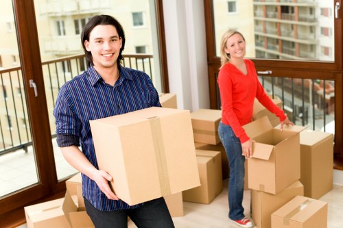 Professional team handling heavy furniture removal in Queens Park